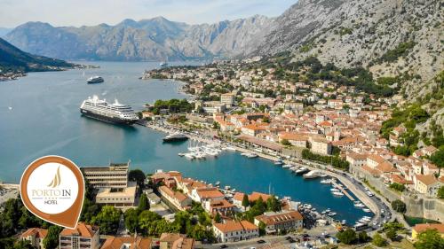 a view of a harbor with a cruise ship in the water at Hotel Porto In in Kotor