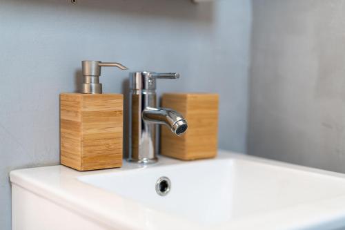 a sink with two faucets on top of it at VILLA KOSTA in Naousa-Paros in Naousa