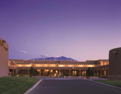 a large building with a mountain in the background at Hyatt Regency Tamaya South Santa Fe in Santa Ana Pueblo