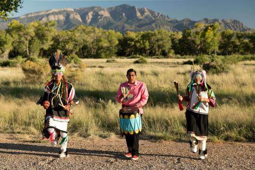 three women walking down a dirt road with their weapons at Hyatt Regency Tamaya South Santa Fe in Santa Ana Pueblo