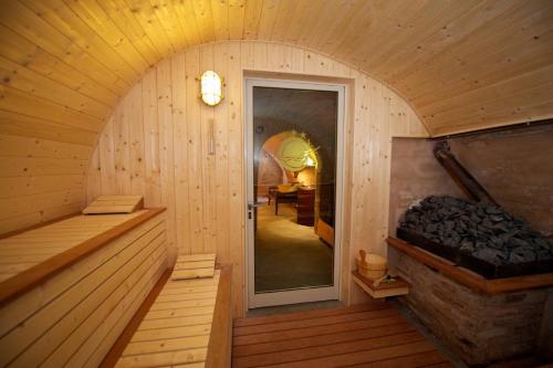 an inside view of a sauna with a large door at Angeli di Montefiore in Montefiore dellʼAso