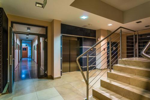 a hallway of a home with stairs and a door at Hotel ***NAT Świnoujście in Świnoujście