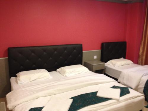 AERO Star Hotelにあるベッド
