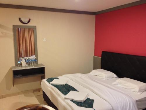 AERO Star Hotelにあるベッド