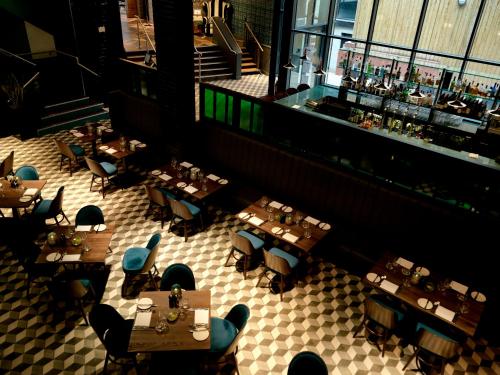 an overhead view of a restaurant with tables and chairs at Hotel Indigo Liverpool by IHG in Liverpool