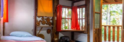Una cama o camas en una habitación de Hostel Casa de Nelly