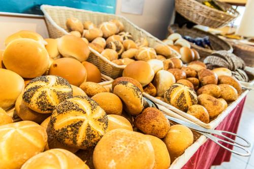 a display of breads and other foods in baskets at Hotel American in Lignano Sabbiadoro