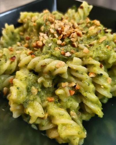 a pile of pasta with nuts on a plate at SESIMA turismo rurale in Mistretta