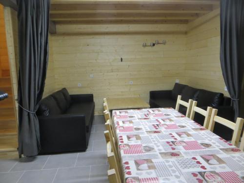 a room with a table and chairs and a couch at Domaine Du Sauveur in Luz-Saint-Sauveur