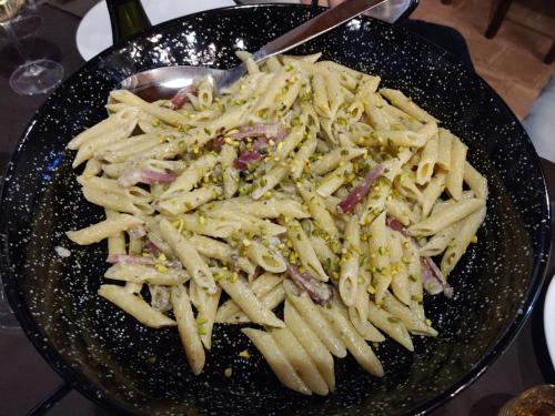 a bowl of pasta with a spoon in it at SESIMA turismo rurale in Mistretta