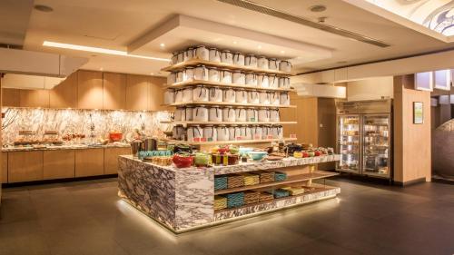 a kitchen with a counter with food on it at Hotel Indigo Shanghai On The Bund by IHG in Shanghai