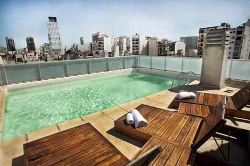 a swimming pool on the roof of a building at Salguero Apart By Zafiro in Buenos Aires