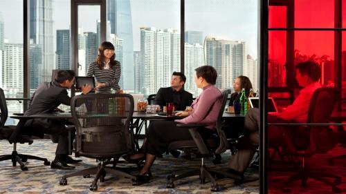 people sitting at tables in a restaurant at Hotel Indigo Shanghai On The Bund, an IHG Hotel in Shanghai