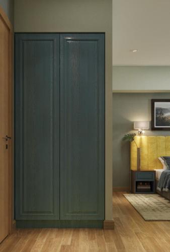a room with green closet doors in a bedroom at Centric Baku Boutique Hotel in Baku