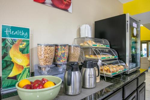 a kitchen counter with food and a bowl of fruit at Quality Inn Johnson City I-26 exit 17 in Johnson City