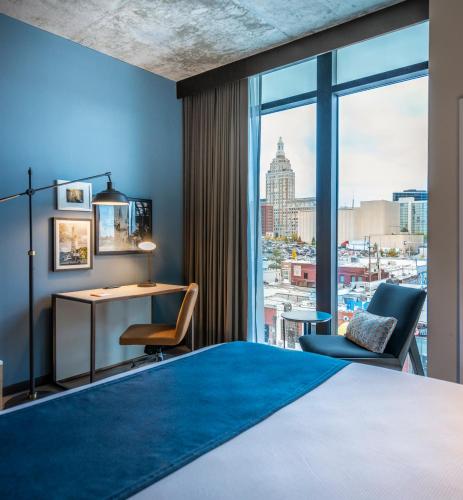 a hotel room with a view of a city at Hotel Indigo Tulsa DWTN/Entertainment Area in Tulsa