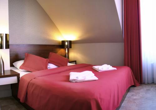 Ένα ή περισσότερα κρεβάτια σε δωμάτιο στο Apartamenty Mesa Grill Restaurant Cafe