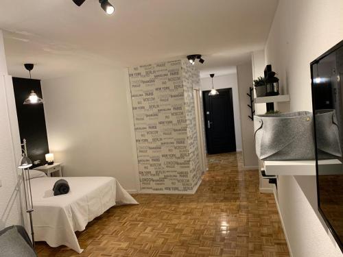 a room with a white table and a wall with writings at LOFT ESTUDIO CATEDRAL CASA LIS in Salamanca
