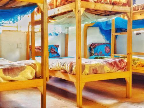 two bunk beds sitting in a room with at Blend Lodge and Kitchen - Pakachere in Zomba