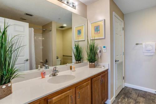 a bathroom with a sink and a mirror at Sterling Reef 2 in Panama City Beach