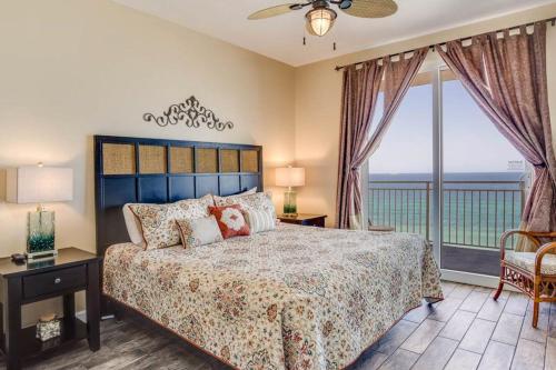 a bedroom with a bed with a view of the ocean at Sterling Reef 2 in Panama City Beach