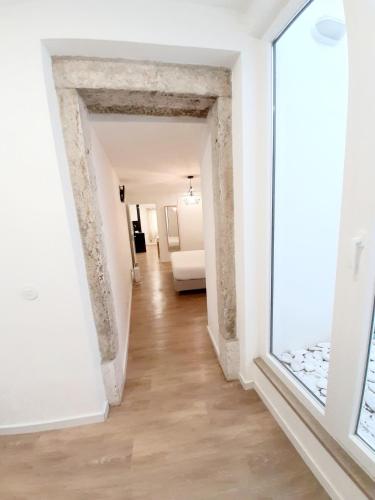 Ένα ή περισσότερα κρεβάτια σε δωμάτιο στο Residenza Dutzu - Aparthotel Leiria