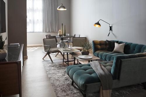 a living room with a couch and a table at Fitler Club in Philadelphia