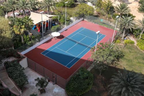 an overhead view of a tennis court at Radisson Blu Hotel, Abu Dhabi Yas Island in Abu Dhabi