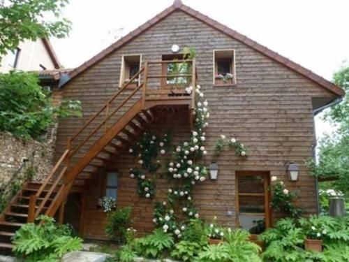 a house with a staircase on the side of it at Le Clos Chedeville in Chartres