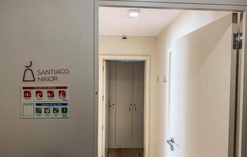 a hallway with a door leading into a room at Up Estalagem dos Padres in Albergaria-a-Velha
