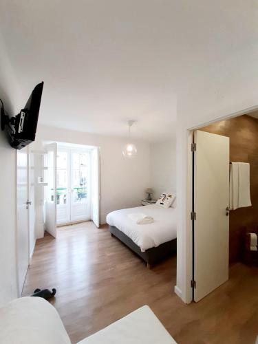 Ένα ή περισσότερα κρεβάτια σε δωμάτιο στο Residenza Dutzu - Aparthotel Leiria