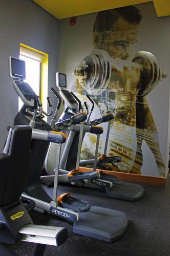 a gym with a painting of a fire hydrant on the wall at Park Inn by Radisson Abu Dhabi Yas Island in Abu Dhabi