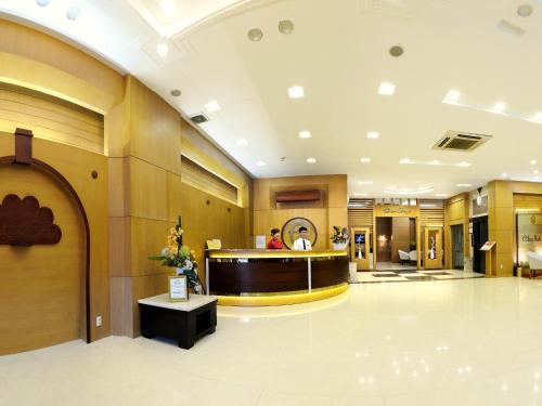 a lobby of a hospital with a reception desk at Elios Hotel in Ho Chi Minh City