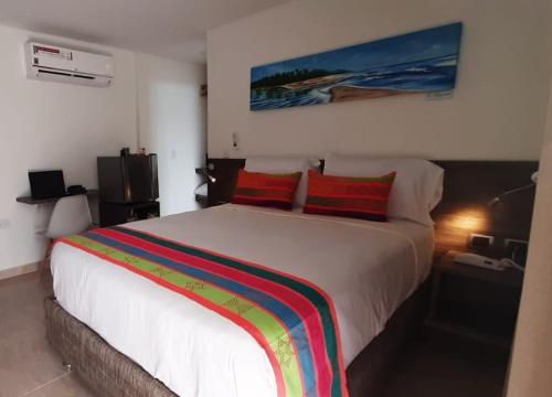 A bed or beds in a room at San Bernardo Hotel