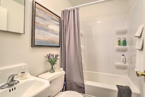 a bathroom with a toilet and a sink and a shower at Upscale Apt at The Lofts in Historic Downtown Lead in Lead