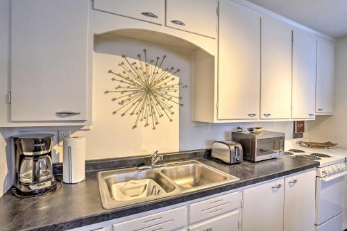 a kitchen with a sink and a microwave at Beauty in the Black Hills An Upscale Apt in Lead in Lead