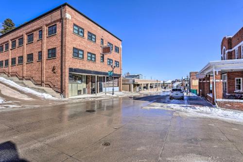 an empty city street with a brick building at Beauty in the Black Hills An Upscale Apt in Lead in Lead