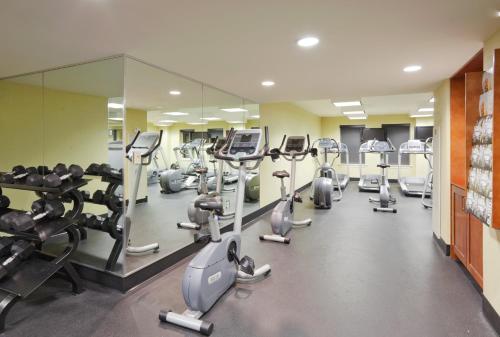 a gym with treadmills and elliptical machines at Crowne Plaza New Orleans French Qtr - Astor by IHG in New Orleans