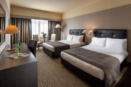 Posteľ alebo postele v izbe v ubytovaní Holiday Inn Rome - Eur Parco Dei Medici by IHG