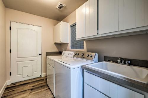 a kitchen with a white dishwasher and a sink at Luxury Sedona Living Remodeled with Red Rock Views! in Sedona