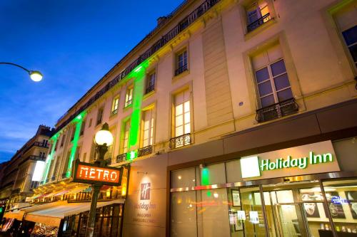 a building with a sign in front of it at Holiday Inn Paris Opéra - Grands Boulevards by IHG in Paris