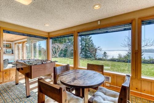 a living room with a table and a foos ball at The Bridge and Balcony in North Bend