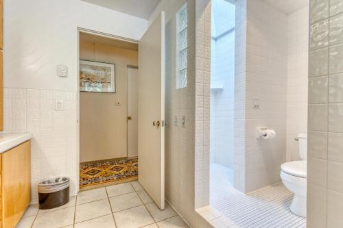 a bathroom with a shower and a toilet at The Bridge and Balcony in North Bend