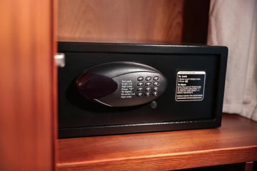 a remote control in a drawer of a room at Hanoi Fiesta Central Hotel and Spa in Hanoi