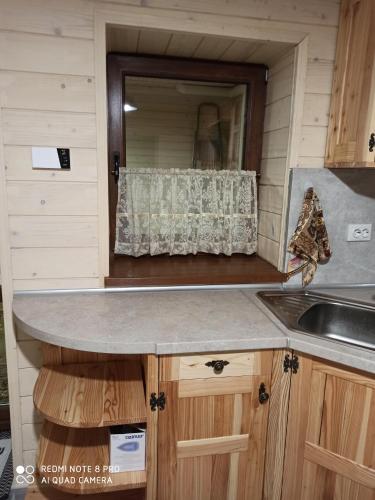 a kitchen with a sink and a window at Brand NEW 2020 specious apartments DRUZI 3 in Bukovel