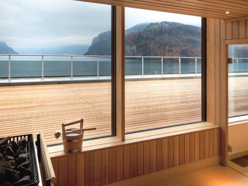 a balcony on a cruise ship looking out at the ocean at Seehotel Waldstätterhof Swiss Quality in Brunnen