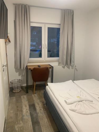 Una cama o camas en una habitación de Grüner Baum