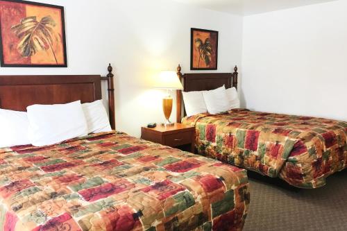 Ein Bett oder Betten in einem Zimmer der Unterkunft Bayside Motel Trenton
