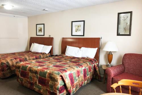 Säng eller sängar i ett rum på Bayside Motel Trenton