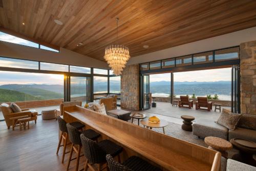 a living room with a view of the mountains at Alkira Lodge in Brenton-on-Sea